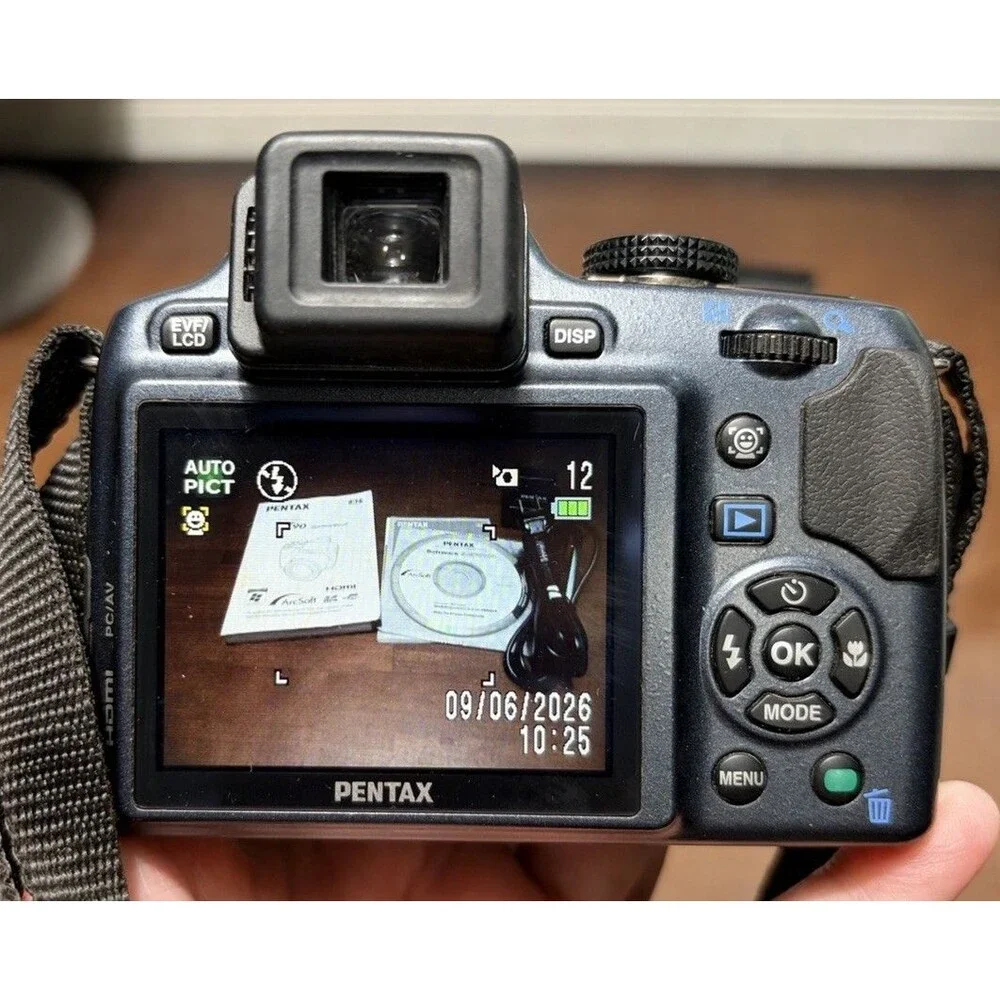 Pentax X90 12.1MP Digital Bridging Camera w/manual, Battery, Charger & Strap